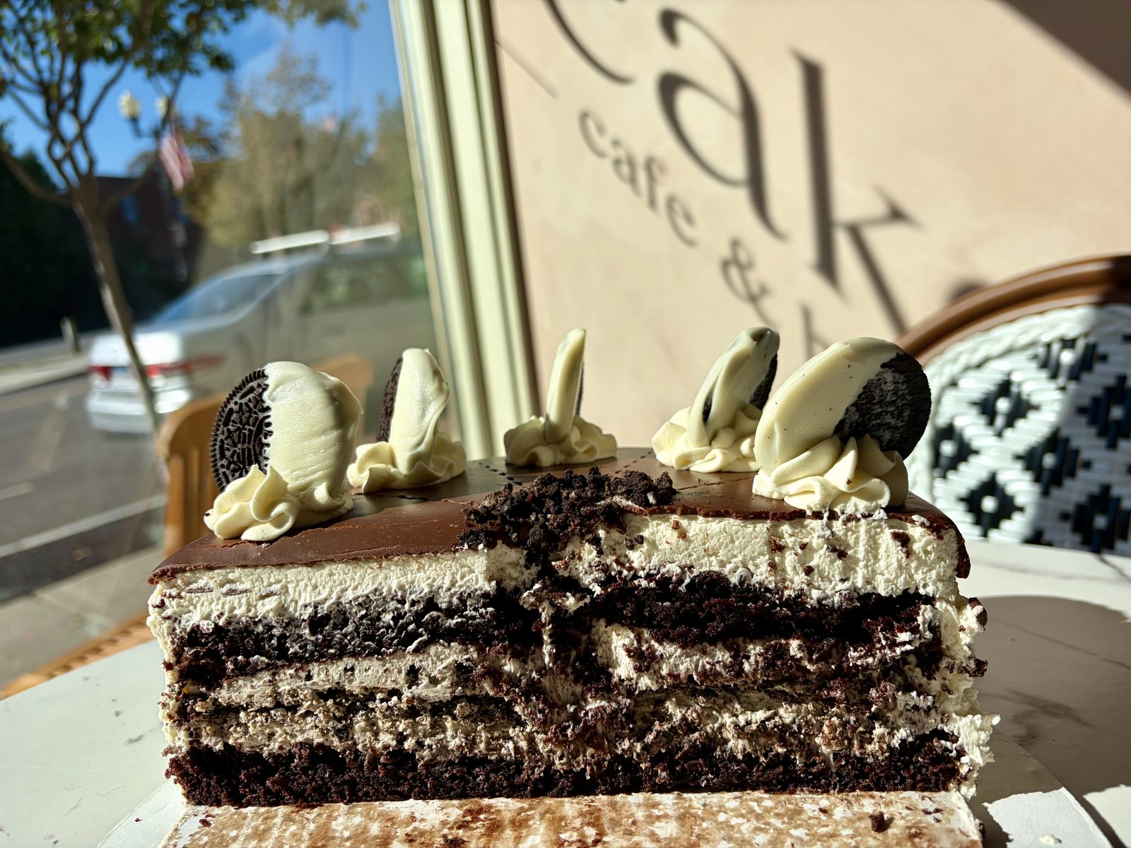 Cookies and cream cake, cut open, in the front window